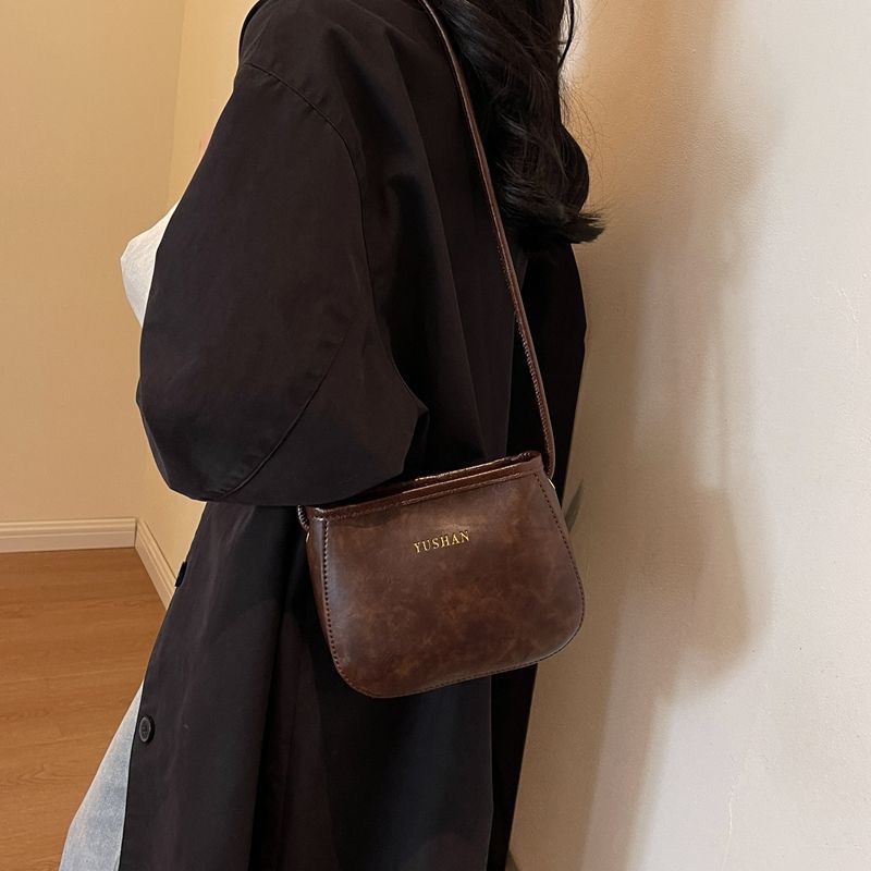 搭单肩斜挎包复古水桶